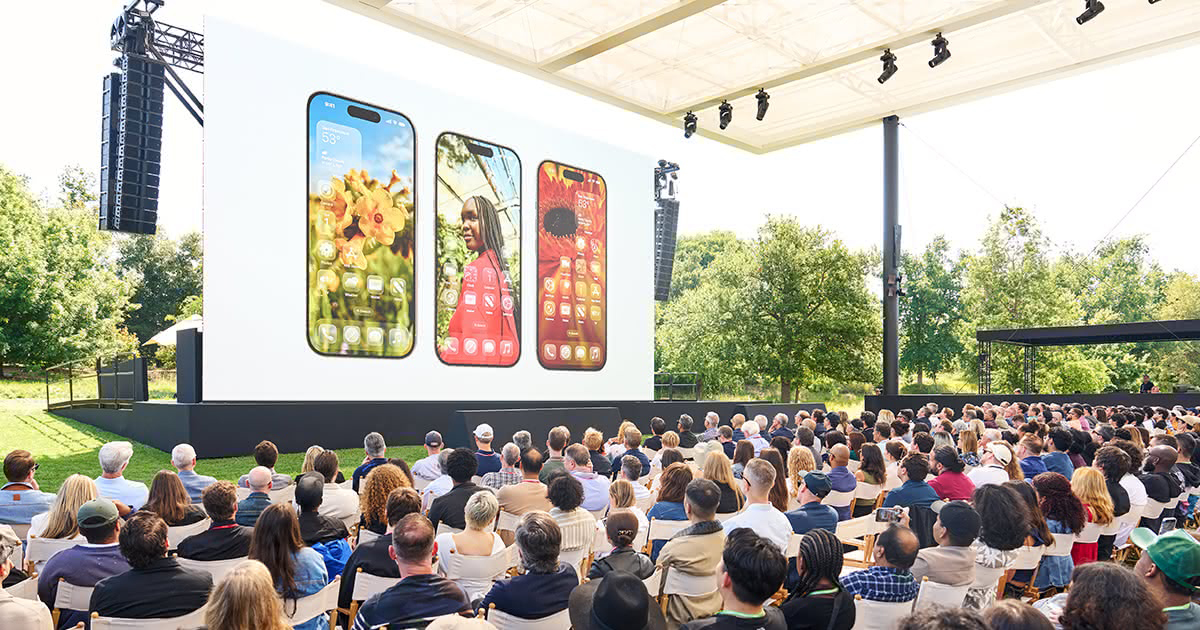 WWDC attendees at Apple Park with rainbow arch